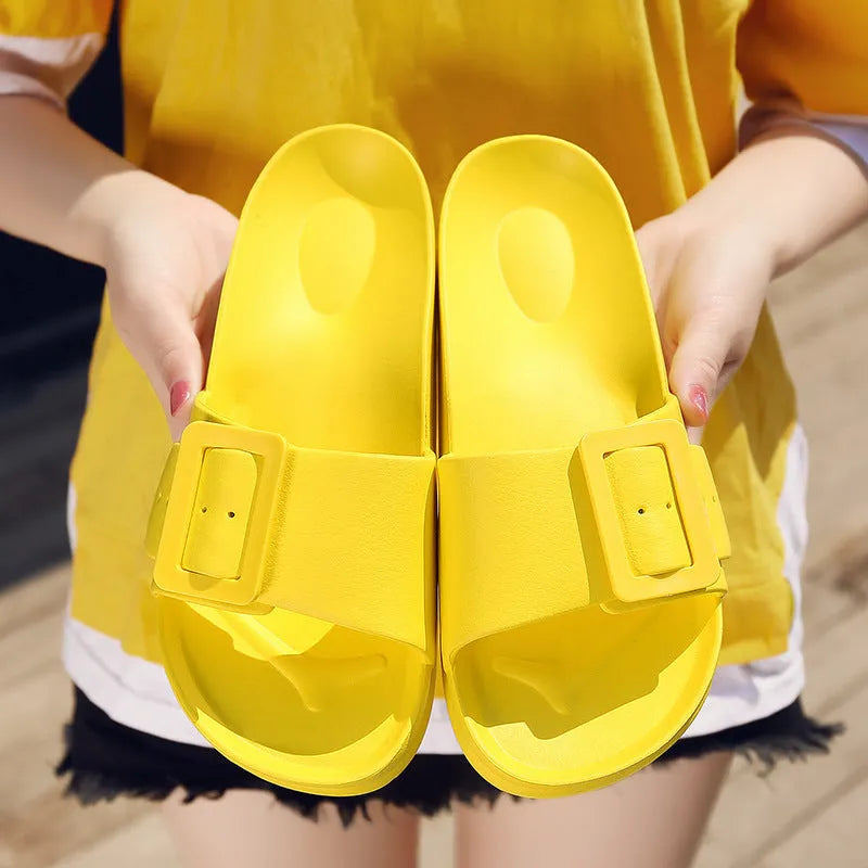Women's grey blue EVA flip-flop sandals with a buckle strap on a white background.