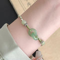Jade green copper bracelet with peace buckle double ring design and ethnic style weaving