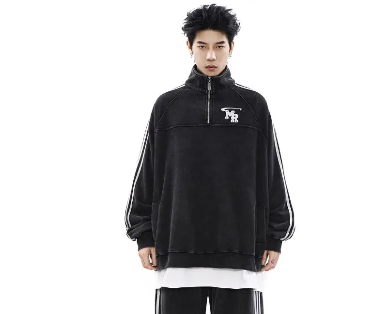 Man wearing a black American retro stand collar long sleeve hoodie coat.