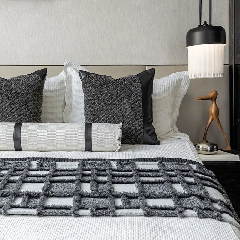 Grey and white plaid bed runner and nap blanket set with a pillow on a 1.8m bed, demonstrating universal fit.