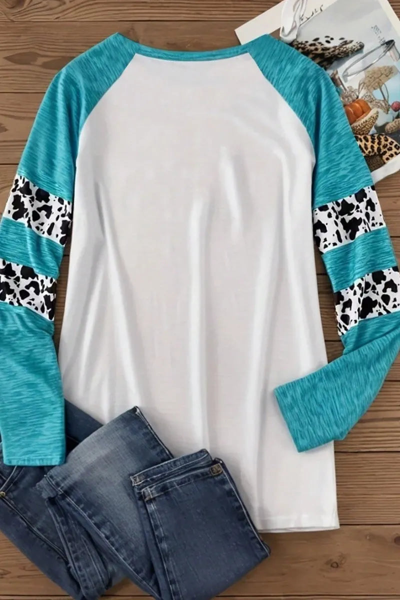 Sky blue long sleeve t-shirt with a white 3D digitally printed Halloween pumpkin graphic.