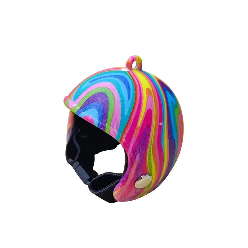 Assortment of small colourful plastic chicken helmets showing rainbow, zodiac, and patterned designs.