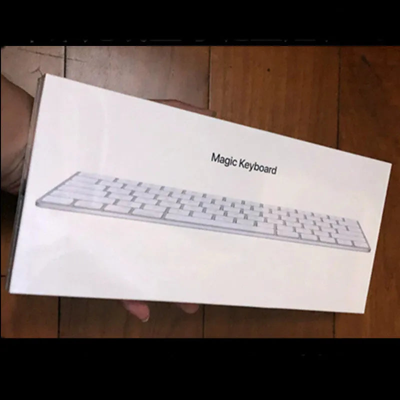 White Apple G6 Bluetooth wireless keyboard with ultra-thin metal design on desk