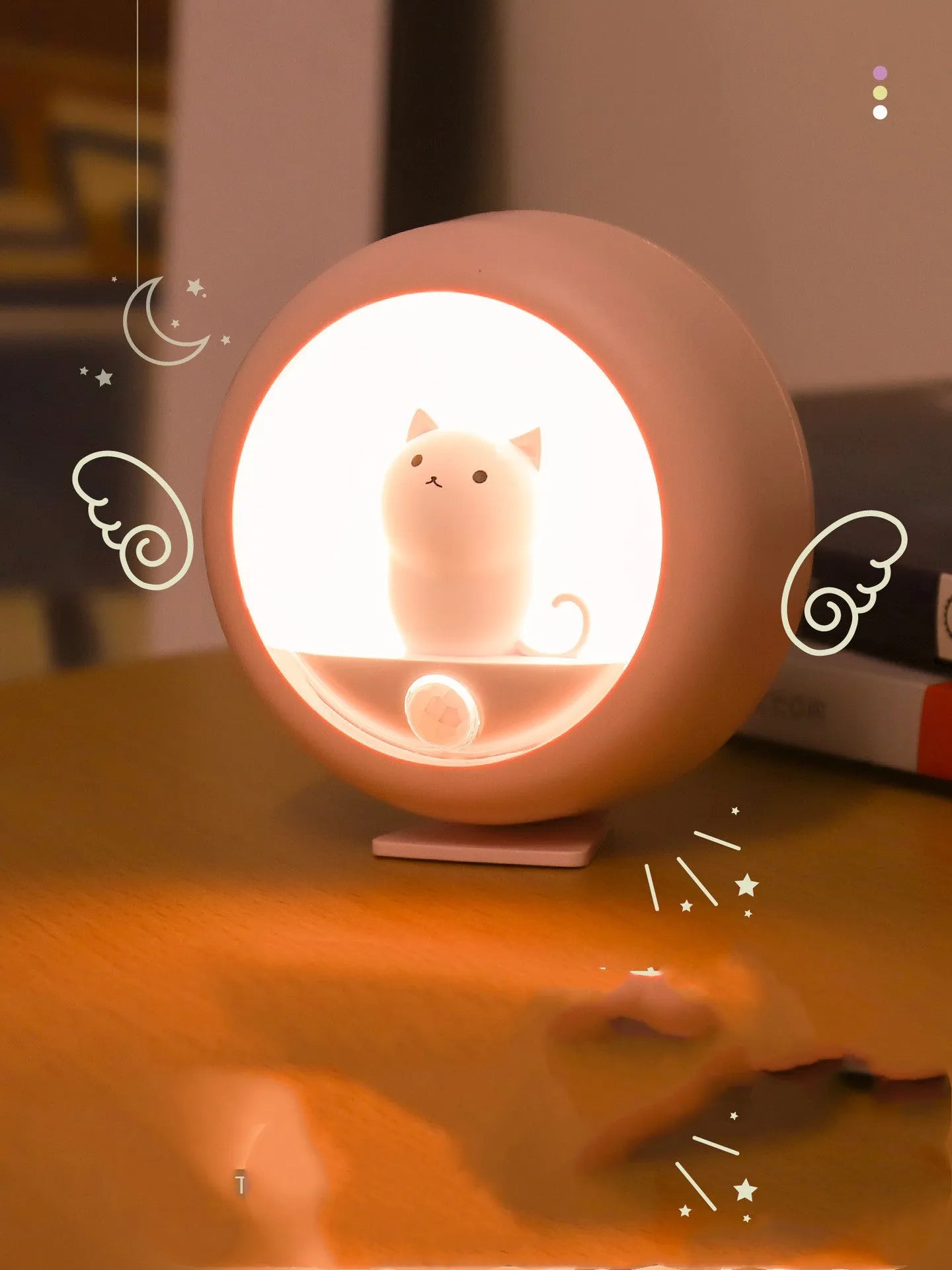 Baby bedside sleep lamp showing orange, pink, and white colour options with projection light feature