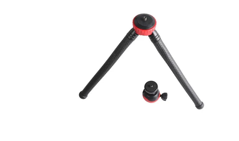 Black octopus tripod with flexible rubber legs wrapped around a pole, holding a mobile phone.