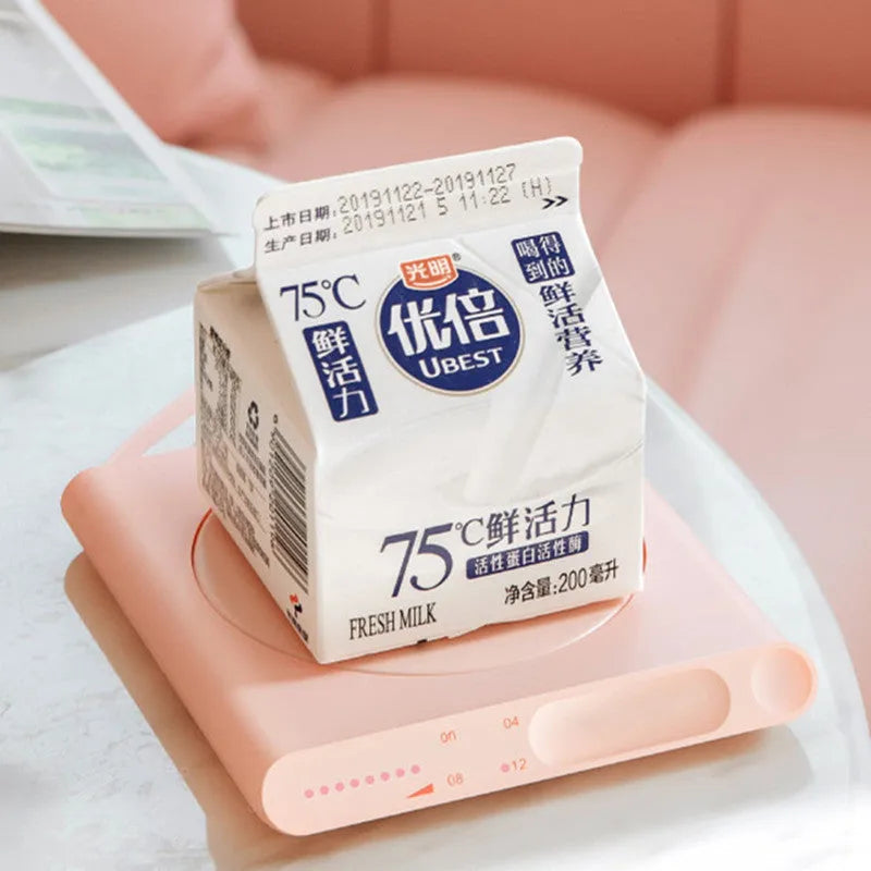USB-powered heating cup coaster pad with mechanical timer in pink and white colour options