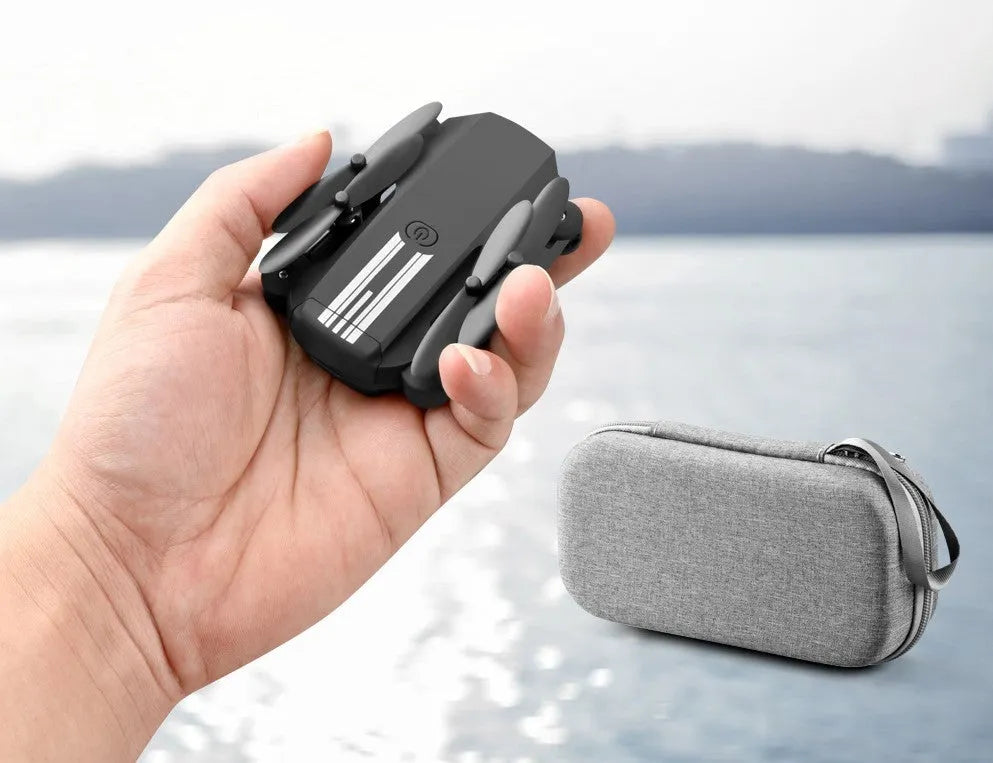 LS Mini foldable drone with 4K camera in black and grey, unfolded on a flat surface