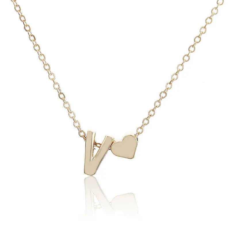 Peach heart shaped letter necklace pendant in gold and silver alloy finishes
