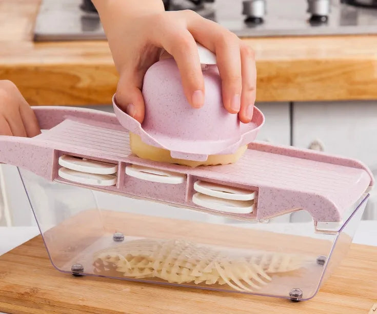 Multifunctional vegetable cutter with 7 stainless steel blades on a kitchen countertop