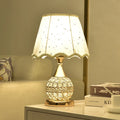 Gold crystal desk lamp with hand-finished pendant and iron art base on wooden surface