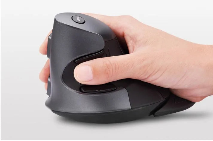 Black M618 wireless vertical ergonomic mouse with USB receiver on a wooden desk.