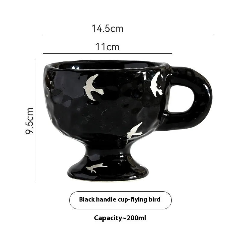 Handmade irregular solid colour ceramic mug on a table