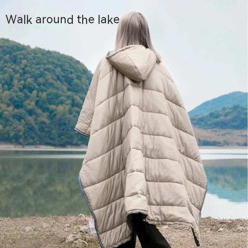 Outdoor cloak sleeping bag worn as cape showing grey colour and 200x140cm dimensions