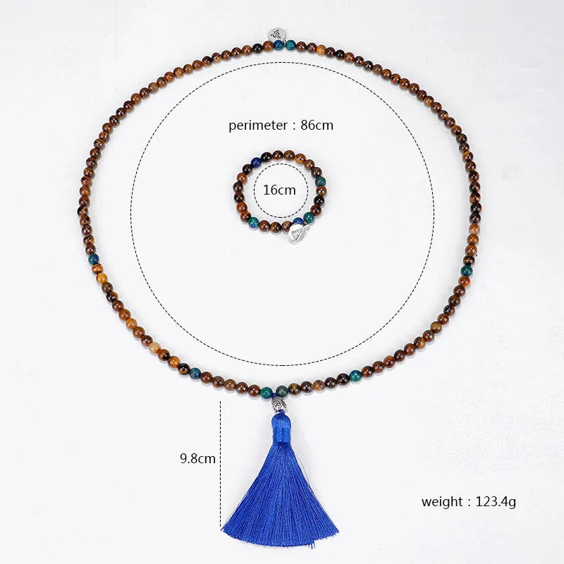 Handmade tiger eye stone bead necklace with Buddha head pendant and tassel on women model