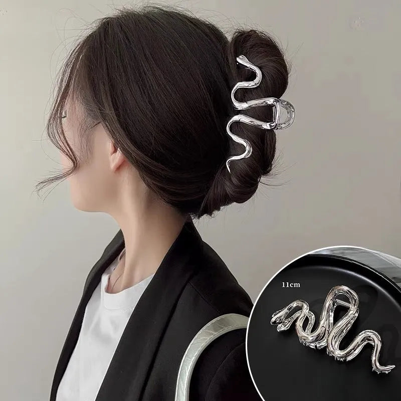 Slytherin serpentine snake design metal hair barrette in silver or gun black, measuring 10.5 cm.