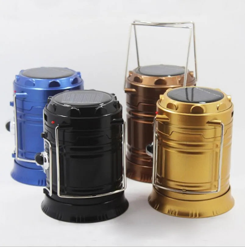 Collapsible LED solar camping lantern in Blue or Gold with reflective lenses, rubber handle and water resistant ABS body