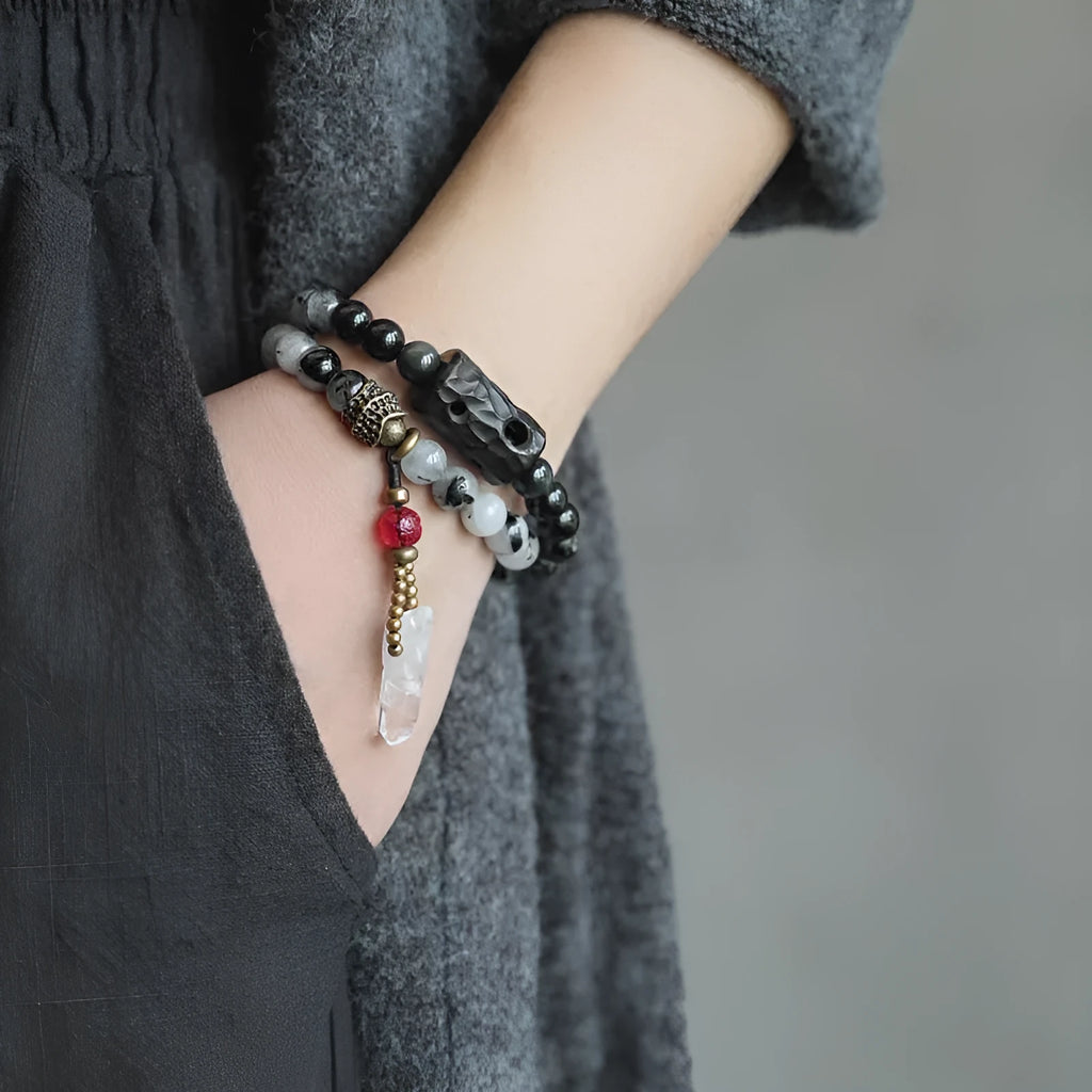 Men's black hair crystal bracelet with white crystal tassel in ethnic design with bending and lacing elements
