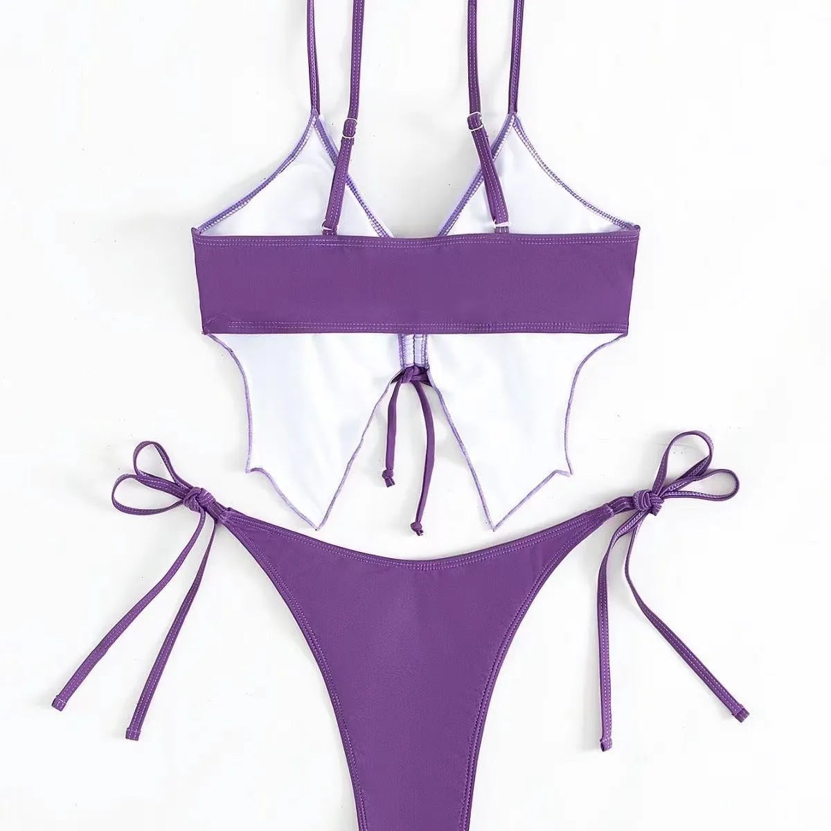 Women's purple split bikini swimsuit with bow detailing on the front, showing sleeveless top and briefs.