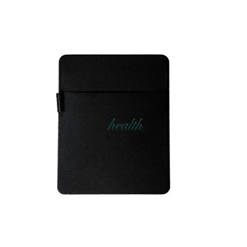 Black adhesive laptop back storage bag attached to a laptop, 15x12 cm, with pen loop and small items inside
