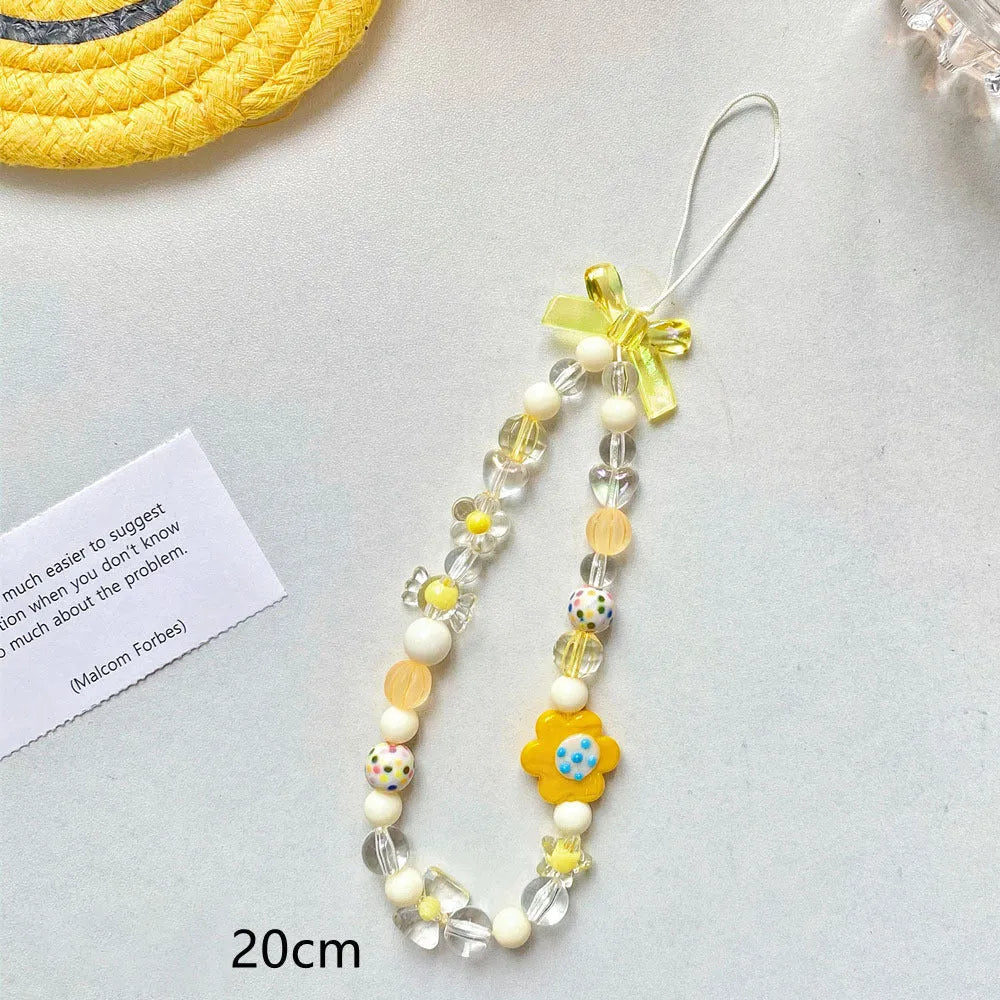 A blue beaded flower mobile phone lanyard with a hand rope design, measuring 1 metre long.