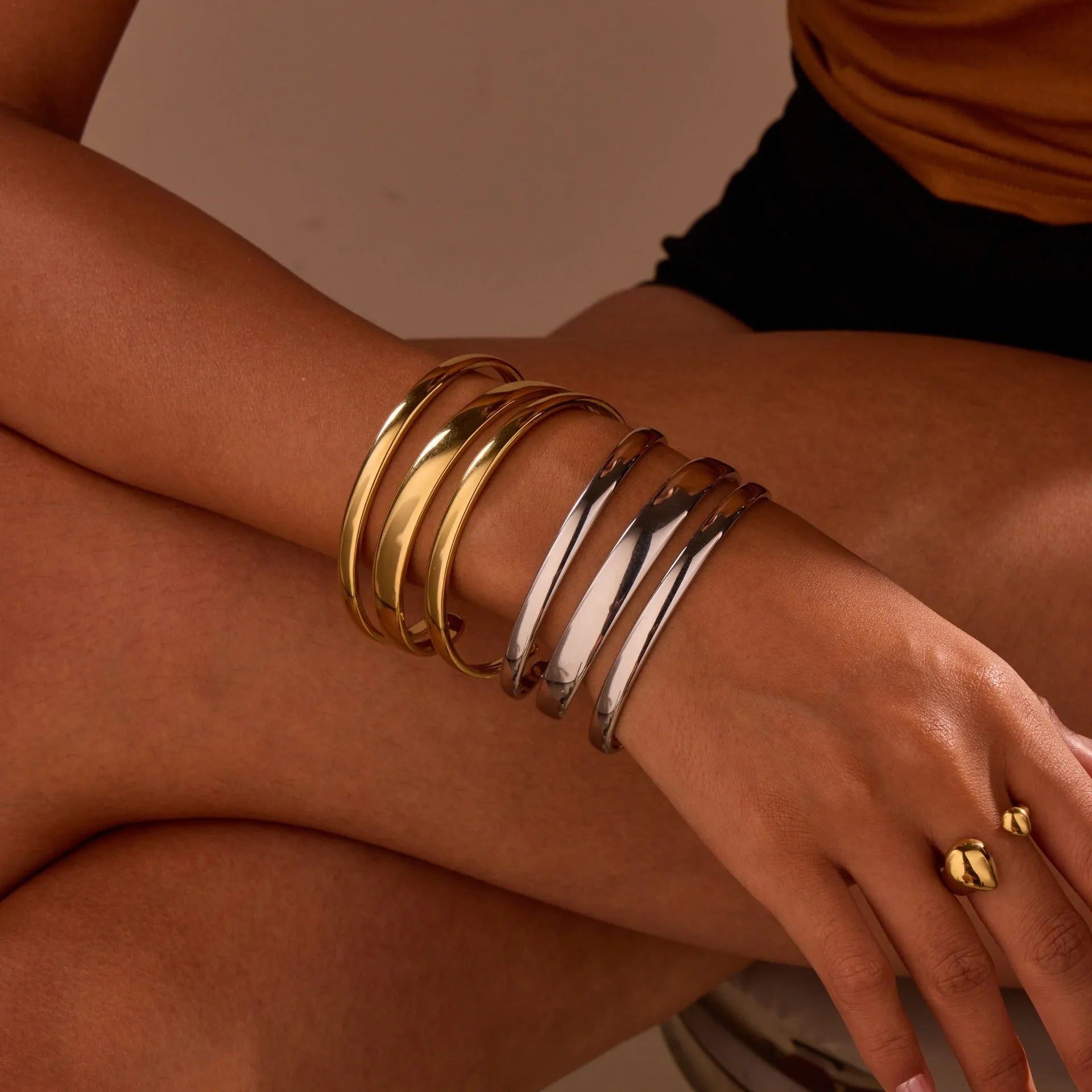 Women's stainless steel bracelet with geometric design and simple opening mechanism in gold electroplated finish