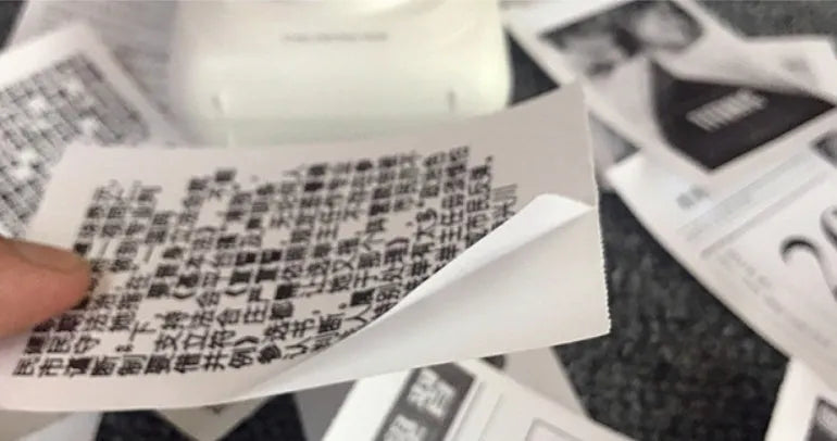 PerPage mini thermal printer paper rolls in regular, sticker, and label types with blue, pink, white, violet, and yellow options