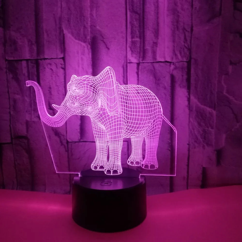 3D elephant-shaped acrylic desk lamp with seven colour modes, USB-powered, on a desk surface