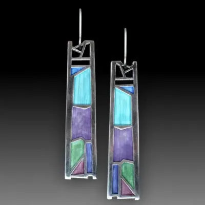 Silver coloured women's earrings with an irregular water drop shape made from alloy.