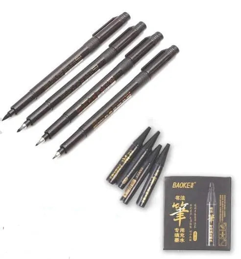 Set of 4 black calligraphy felt tip pens with ink refill bottles on a white surface