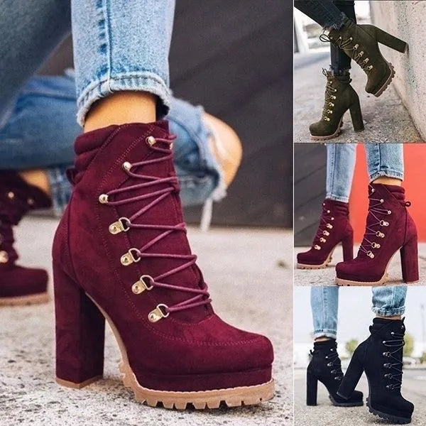Women's army green suede Roman boots with high thick heels, a platform sole, and decorative rivets.