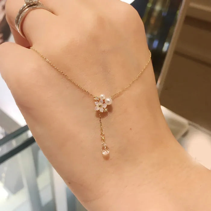 Sterling silver 925 K gold plated pendant necklace with 6mm white shell pearl, 4mm crystal, and 42+5cm clavicle chain.