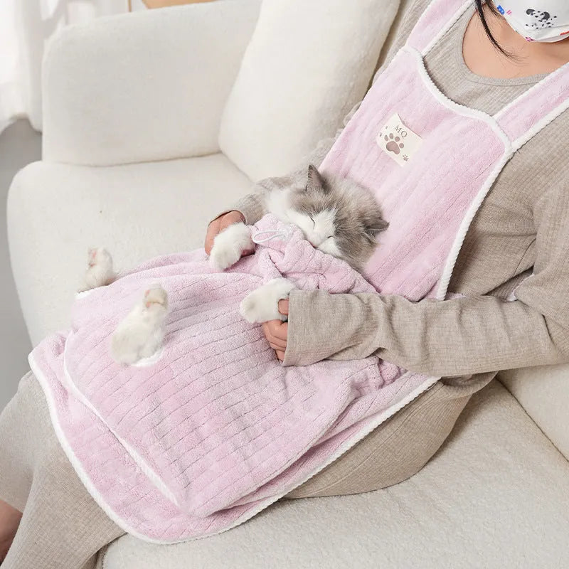 Cloth cat petting apron in a striped pattern, shown worn by a person holding a cat.