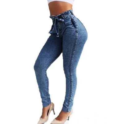 Women's fringed jeans in light blue, grey, and dark blue cowboy fabric, showing detailed fringe hem.