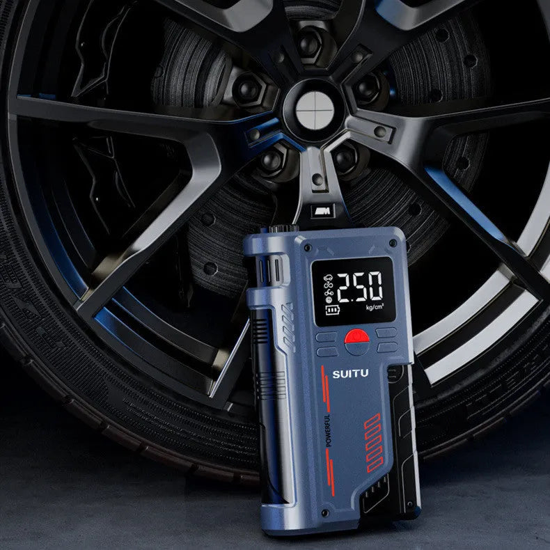Wireless lithium emergency jump starter with integrated tyre inflator showing battery clips and digital pressure display