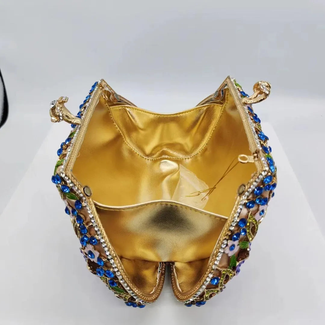 Gold oval metal evening clutch with enamel flower, hollow, diamond and dripping oil detail, 22 x 12 x 6 cm