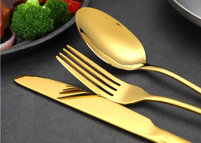 24-piece stainless steel cutlery set showing table knives, forks, and spoons in a gold colour option.