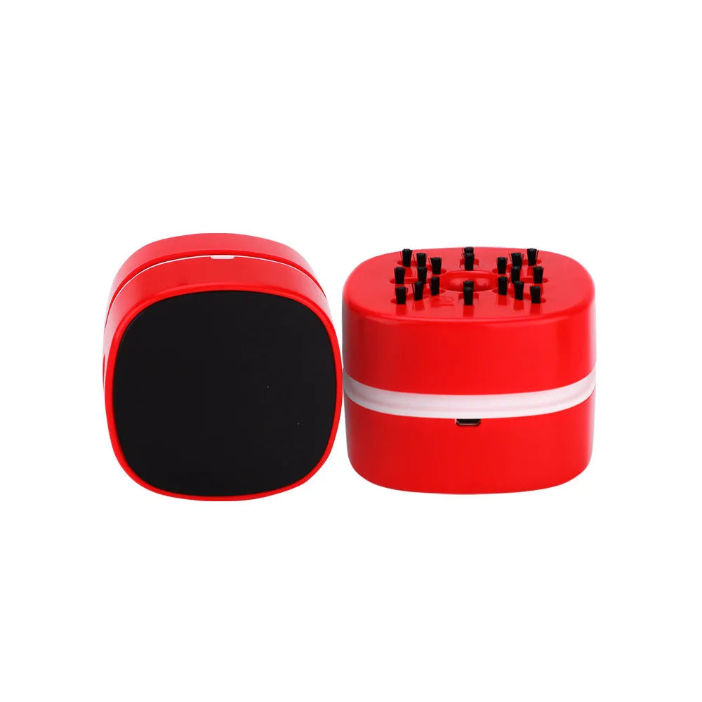Portable desktop vacuum cleaner in blue with dust box and brush nozzle for keyboard and desk cleaning