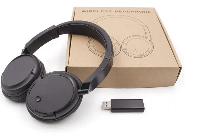 Black wireless stereo headset with USB FM transmitter and audio cable for wired use.