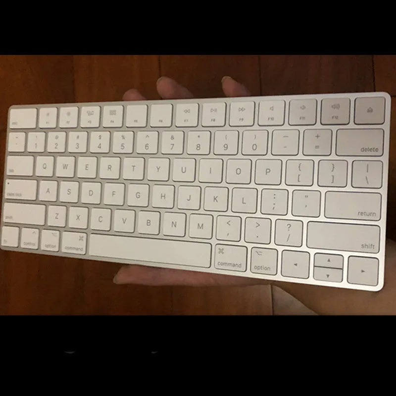 White Apple G6 Bluetooth wireless keyboard with ultra-thin metal design on desk