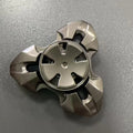 Alloy metal rotating fingertip gyro decompression toy in gun metal and colourful options