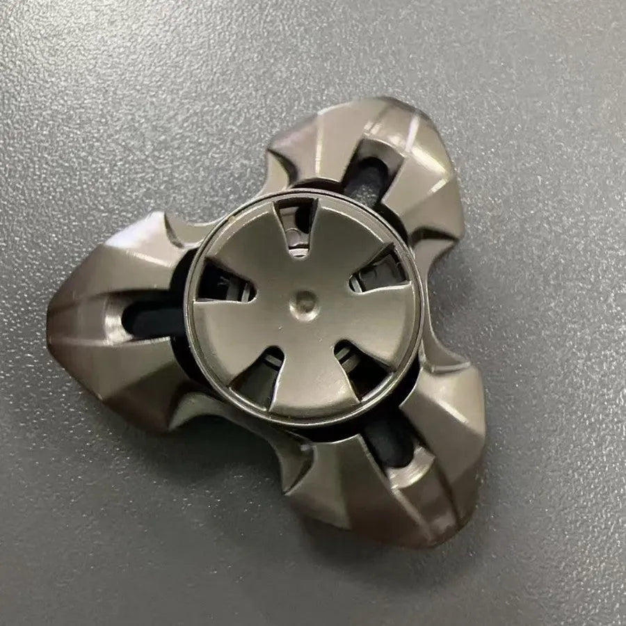 Alloy metal rotating fingertip gyro decompression toy in gun metal and colourful options