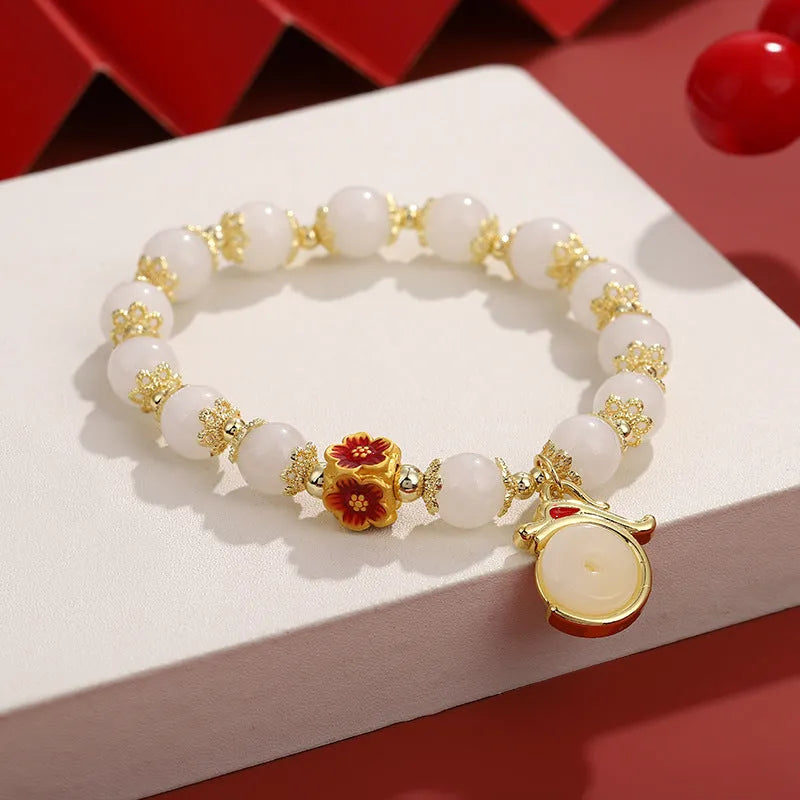 Chinese style natural stone beads bracelet with lucky coin and agate beads on white background