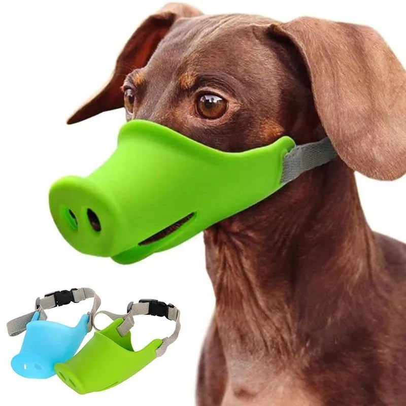 Green silicone anti-bite mouth cover for dog with long snout, showing size comparison