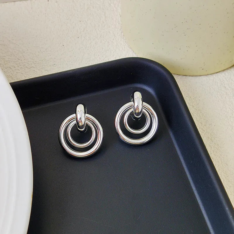 Geometric round ring earrings with irregular exotic design in gold or silver electroplated finish