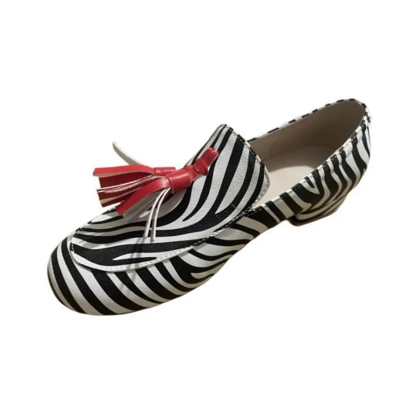 Women's leopard print tassel flat loafers with round toe artificial PU upper on light background