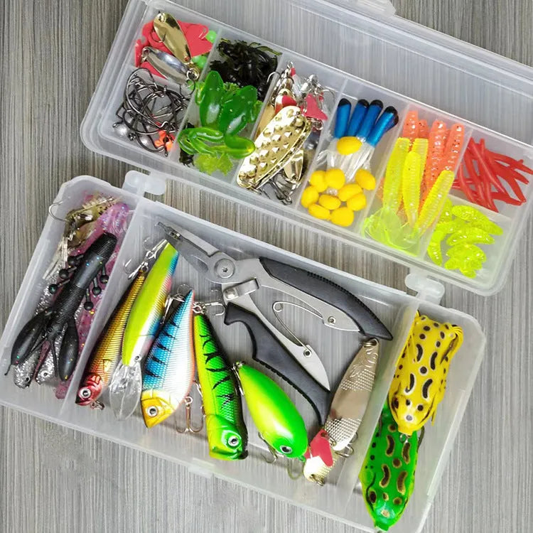 142-piece fishing lure suit with hard minnow baits, sequin spinners, and metal fishing pliers laid out on a table.