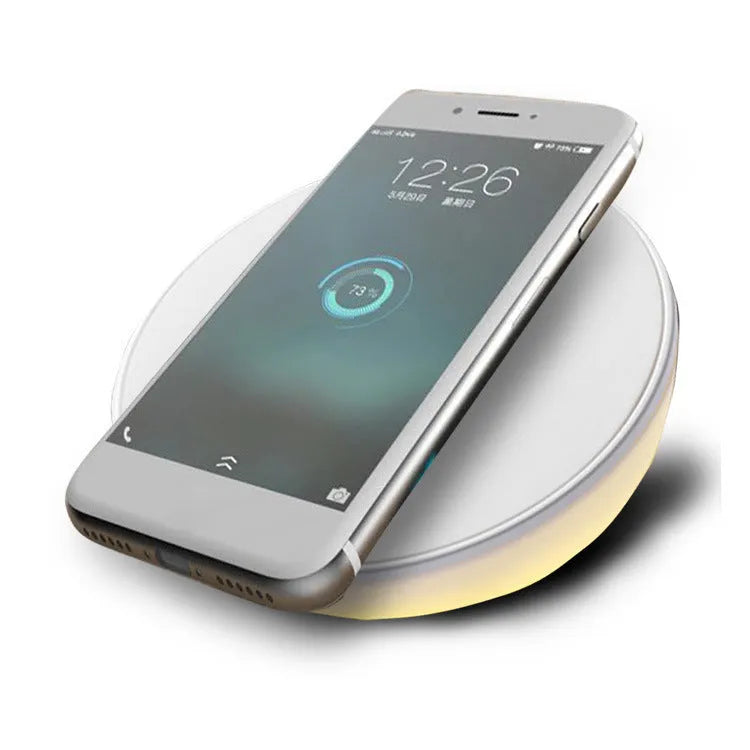 White wireless charger with digital clock display, alarm buttons and night light function