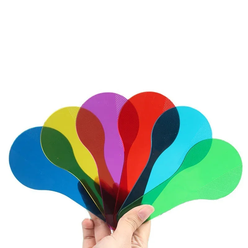 Six colourful PVC learning boards for children, showing red, yellow, blue, green, orange, and purple