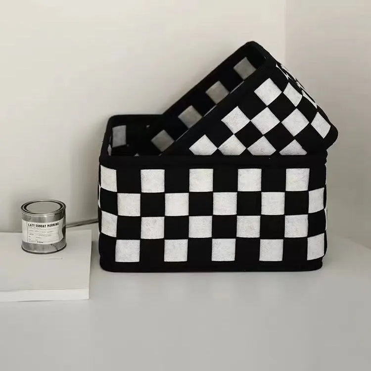 Checkerboard patterned felt folding storage basket showing its size and textured weave.