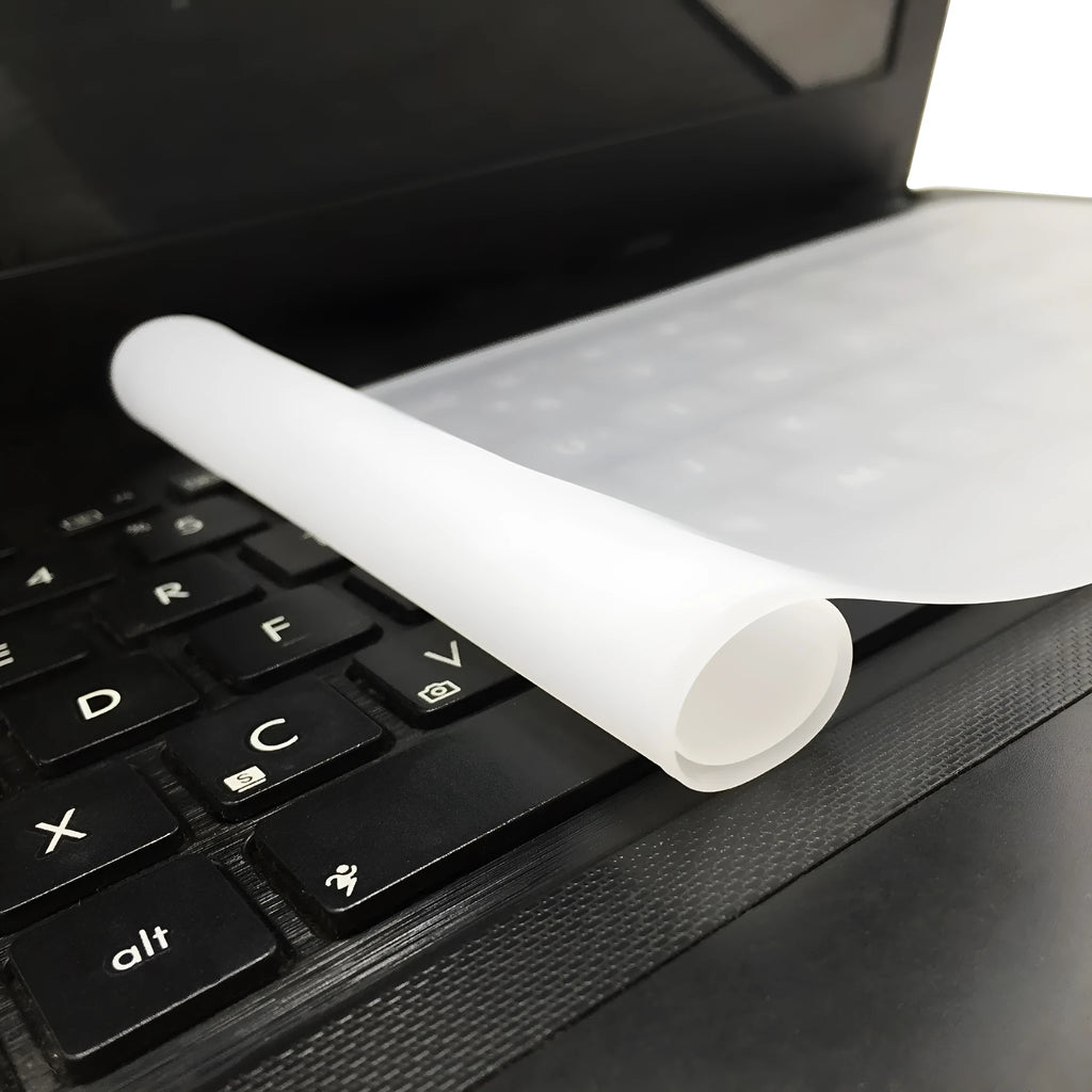Transparent silicone laptop keyboard dust film on a notebook close-up
